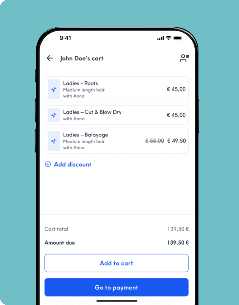A close-up of a smartphone screen against a light teal background, displaying a digital checkout interface titled "John Doe's cart". The screen lists three salon services: "Ladies - Roots", "Ladies – Cut & Blow Dry", and "Ladies – Balayage", all assigned to a stylist named Anna. An option to "Add discount" is visible above a cart total and amount due of €139.50. At the bottom, there is a white "Add to cart" button and a prominent blue "Go to payment" button.