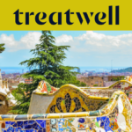 A scenic view of Barcelona from Park Güell, featuring Antoni Gaudís iconic colourful mosaic benches and fairytale-style spires in the foreground, with the city and sea beyond. A large yellow banner at the top displays the "treatwell" logo.